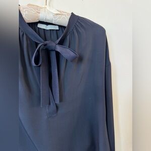 Vince navy silk blouse with tie at neck.